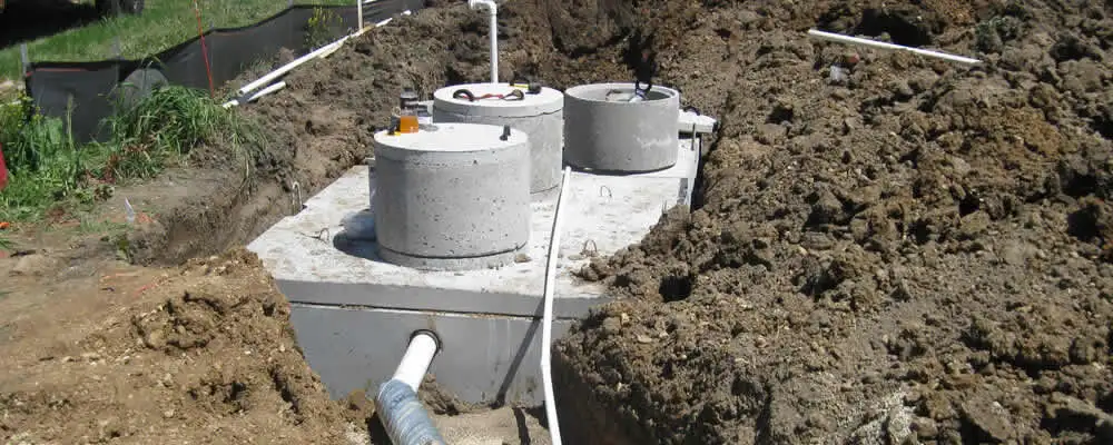 Septic system repair and installation site with tank access ports in Bakersfield, CA